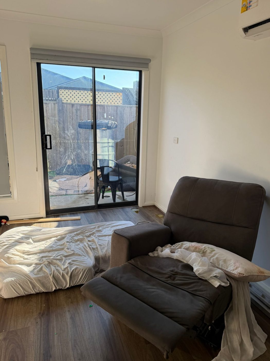 Lounge room mid move-out before cleaning